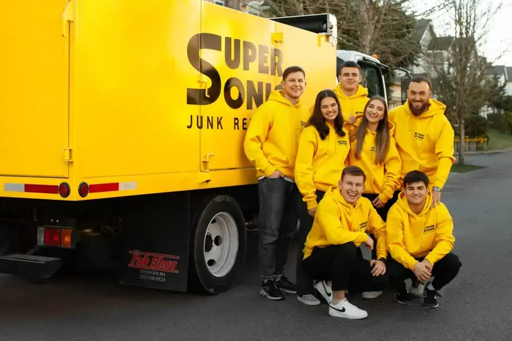 Supersonic Team standing in front of a truck and ready for the Junk Removal in Kent WA