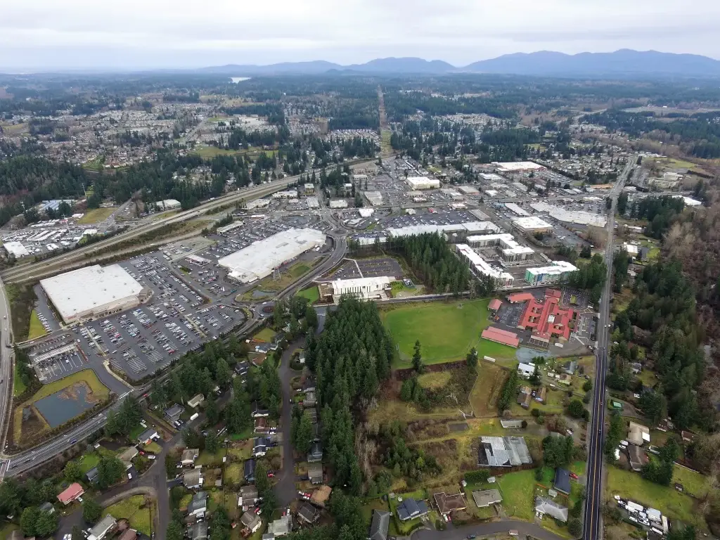 A stunning aerial view of Covington, WA, showcasing the city layout, commercial areas, and surrounding greenery, ideal for promoting Junk Removal in Covington WA.